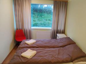 Postel nebo postele na pokoji v ubytování Bakland ad Lágafelli Apartment