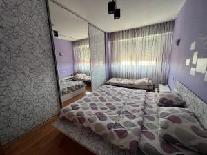 Ένα ή περισσότερα κρεβάτια σε δωμάτιο στο BGD Home