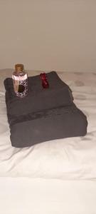 a pile of black towels on a bed at Apartment KAPO- Klima,Parking in Sarajevo +26 photos