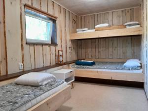 A bed or beds in a room at Annimatsi Camping