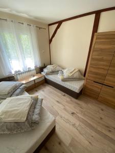 Postel nebo postele na pokoji v ubytování Ośrodek Wypoczynkowy Wratislavia
