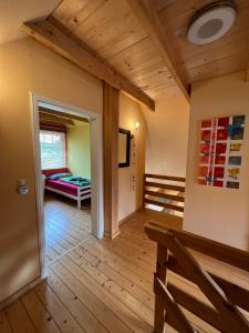 a room with a bench and a bed in a room at Haus Krönchen in Tanne