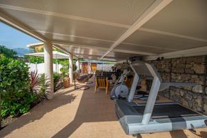 a house with a gym on the patio at Lux Villa Princess in Bar