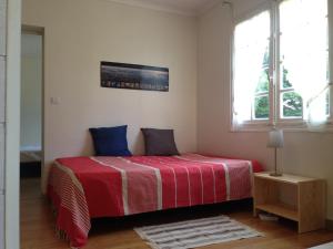 Posteľ alebo postele v izbe v ubytovaní Villa avec Jardin à 250 m de l'océan WIFI + 12 fotografií