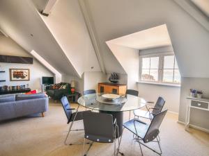 a living room with a table and chairs at 13 Buckfields in Lyme Regis