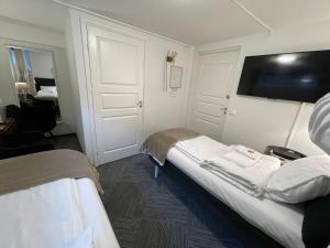 Voodi või voodid majutusasutuse Vid Gekås Ullared Boende B&B toas