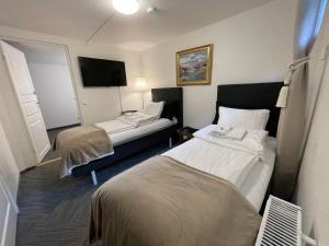 Voodi või voodid majutusasutuse Vid Gekås Ullared Boende B&B toas
