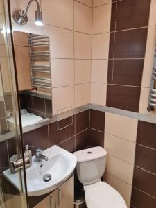Koupelna v ubytování Apartament Wyszyńskiego Szczecin Polska