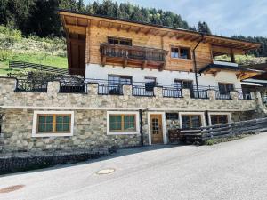a building with a balcony on top of it at Mountainfloor in Grossarl