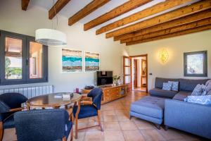 a living room with a couch and a table at Selva - 38903 Mallorca in El Port de la Selva