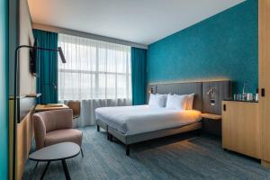 เตียงในห้องที่ Holiday Inn Reims Centre by IHG +104 ภาพ