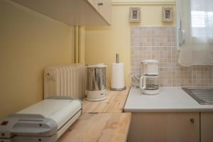 a kitchen counter with two appliances on a counter top at Santa Marina in Ioannina