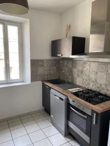 Kuchyňa alebo kuchynka v ubytovaní APPARTEMENT SPACIEUX