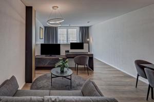 TV a/nebo společenská místnost v ubytování MOOI Apartments Schlieren