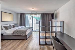 Postel nebo postele na pokoji v ubytování MOOI Apartments Schlieren