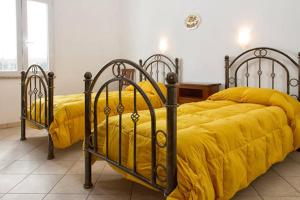 Un pat sau paturi într-o cameră la Agriturismo Pentuma