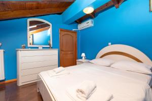 Postel nebo postele na pokoji v ubytování A&S Seaside Maisonette