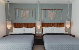 Una cama o camas en una habitación de Ah Xok Suites