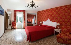 a hotel room with a bed and a dresser at Casa Dolce in Venice