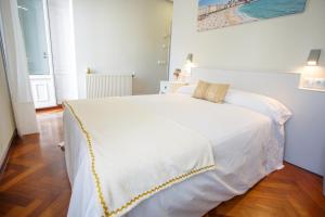 Posteľ alebo postele v izbe v ubytovaní Hostal Costa Coruña