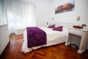 Posteľ alebo postele v izbe v ubytovaní Hostal Costa Coruña