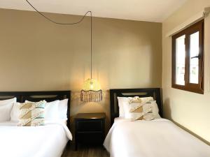 Cama ou camas em um quarto em Magnolia Inn