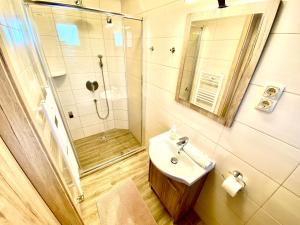 Koupelna v ubytování Unio Vendégház 3 + 22 fotografií