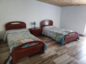 A bed or beds in a room at Albergue Santa Ana