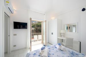Кровать или кровати в номере Residence Buonocore