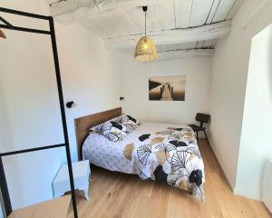 Posteľ alebo postele v izbe v ubytovaní Appartement cosy en cœur de bourg