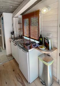 a kitchen with a stove and a counter top at Little California - Adorable Studio Indépendant in Cagnes-sur-Mer +12 photos