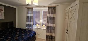 Кровать или кровати в номере Nordseeresidenz Wingst - Fewo cc