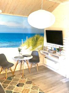 a living room with a view of the ocean at Siedlisko Wytowno in Ustka