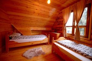 Postel nebo postele na pokoji v ubytování Milanova koliba Zlatar