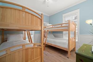 a bedroom with two bunk beds and a window at Aquanut Beach House 30A in Inlet Beach +43 photos