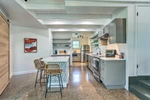 a kitchen with a table and chairs in a room at Hutchinson Island Cottage Steps to the Beach in Fort Pierce +32 photos