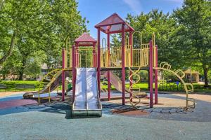 a playground with a slide in a park at 3 Mi to Dtwn Walkable Apt in Cleveland! in Cleveland