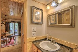 a bathroom with a sink and a dining room at Gated Community w/ Perks! Sparta Family Cabin in Whitehead +31 photos