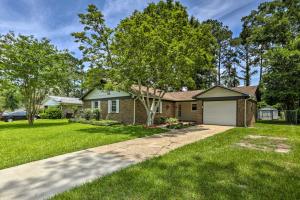 a house with a driveway and a garage at about 8 Mi to FSU Bright Tallahassee Retreat! in Tallahassee