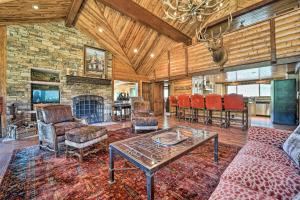 a living room with a couch and a table at Fish Creek Ranch in Dolores Hot Tub and Game Room in Dolores