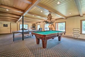 a pool room with two ping pong tables and a chandelier at Fish Creek Ranch in Dolores Hot Tub and Game Room in Dolores