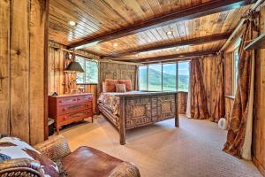 a bedroom with a bed and a desk and a window at Fish Creek Ranch in Dolores Hot Tub and Game Room in Dolores