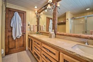 a bathroom with a sink and a large mirror at Fish Creek Ranch in Dolores Hot Tub and Game Room in Dolores +37 photos