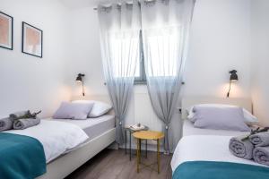 Ένα ή περισσότερα κρεβάτια σε δωμάτιο στο Ascolana Holiday Home