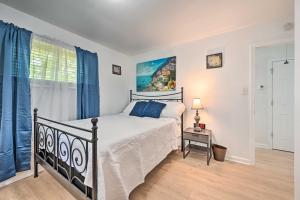 a bedroom with a bed and a window at Greensboro Home Less Than 4 Mi to Downtown! in Greensboro