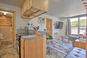 a kitchen with a sink and a stove top oven at Modern Mountain-View Condo at Big Sky Resort! in Big Sky