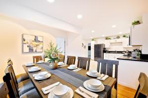 a kitchen and dining room with a table and chairs at Pelican Place in San Diego