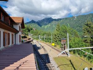 a train station with a view of the mountains at Buffet de la gare 