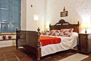 A bed or beds in a room at Casa Azul Barichara