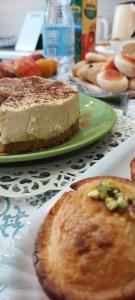 a table topped with a piece of cake and pies at Villa Ginevra in Porto Cesareo +36 photos